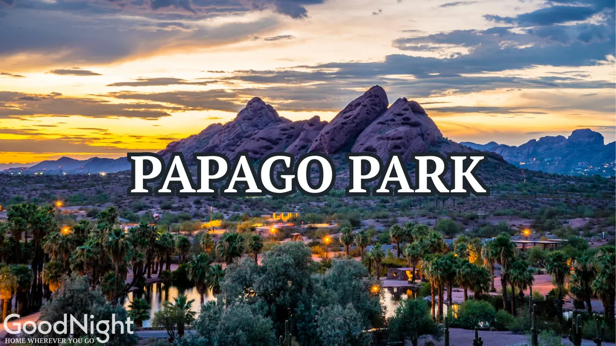 This exterior image captures a serene park area at sunset, framed by palm trees and mountains in the background. The tranquil pathway, lush green space, and golden light create an inviting atmosphere for romantic strolls or peaceful moments outdoors, fitting the urban escape mood.