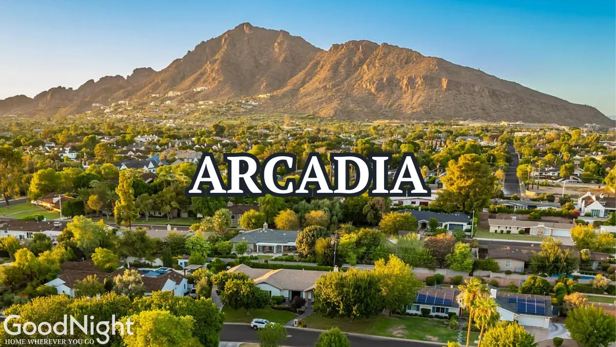 A sweeping view of mountains, residential homes, and lush greenery, offering a sense of community and scenic beauty. The landscape encourages outdoor activities and quiet reflection, ideal for couples seeking both adventure and tranquility.